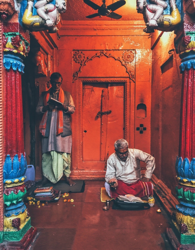 Two priests complete the door frame in a temple in Varanasi.