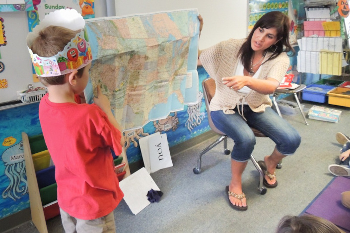 Teacher Lisa Carpentier introduces map-reading skills to her students.